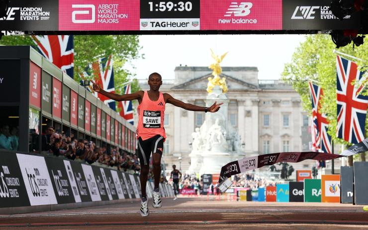 Kenya’s Sabastian Sawe crosses the finish line to win the men’s elite race in the London Marathon