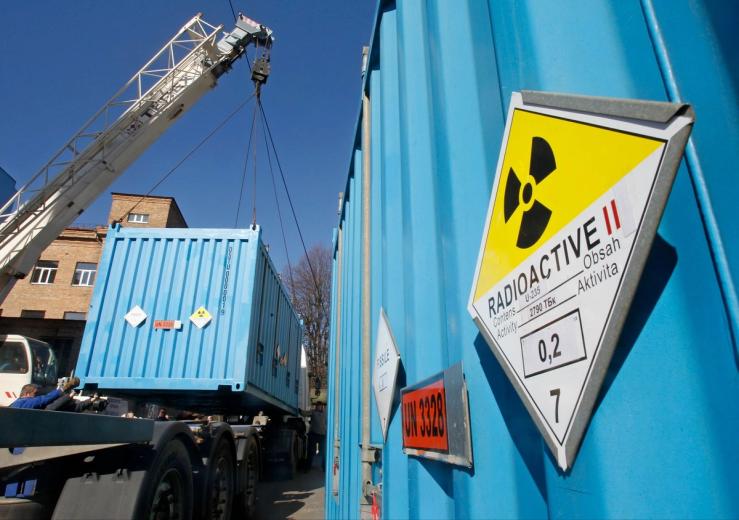 Workers place a container with spent highly-enriched uranium on a truck in Kyiv in 2012.