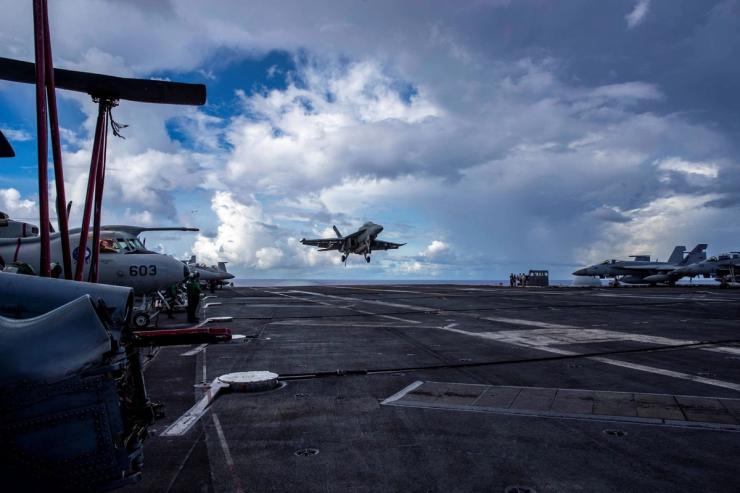 A plane landing on the USS Abraham Lincoln.