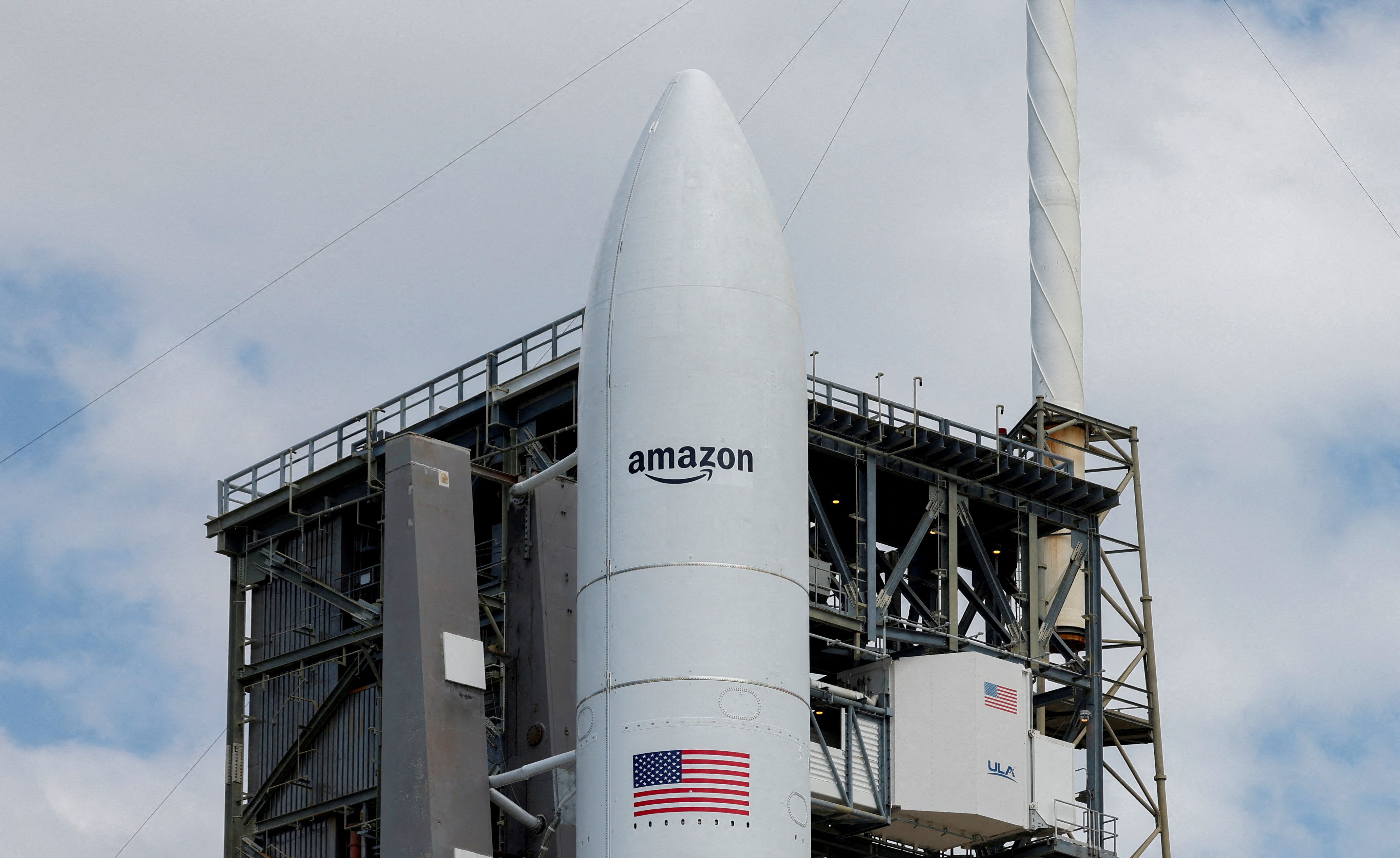 A United Launch Alliance Atlas V rocket is on the launch pad carrying Amazon’s Project Kuiper internet network satellites.