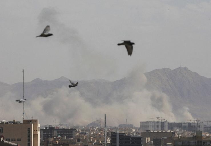 Smoke rises following an explosion in Tehran