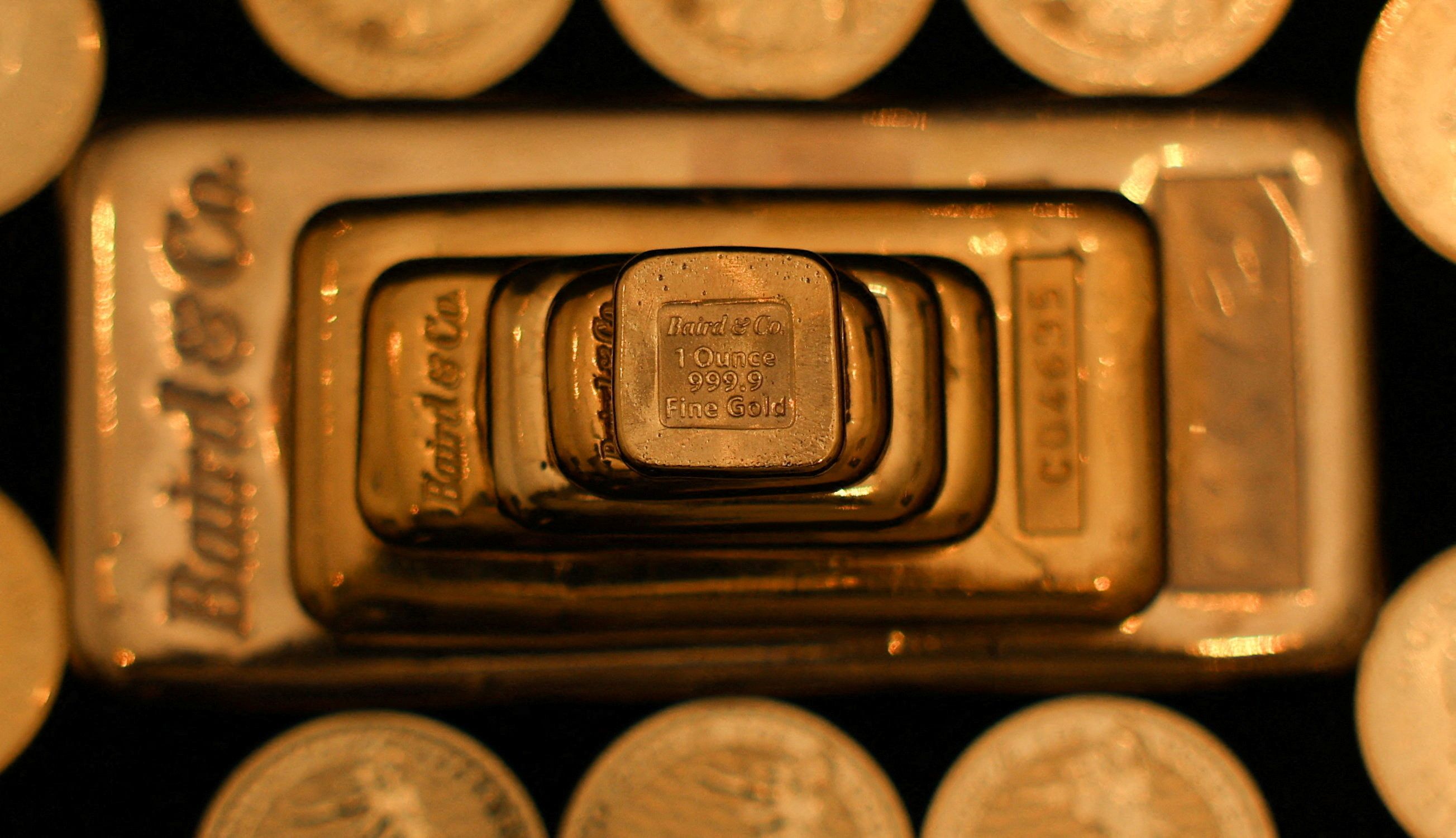 UK gold bullion bars and coins are displayed at Baird & Co in Hatton Garden in London