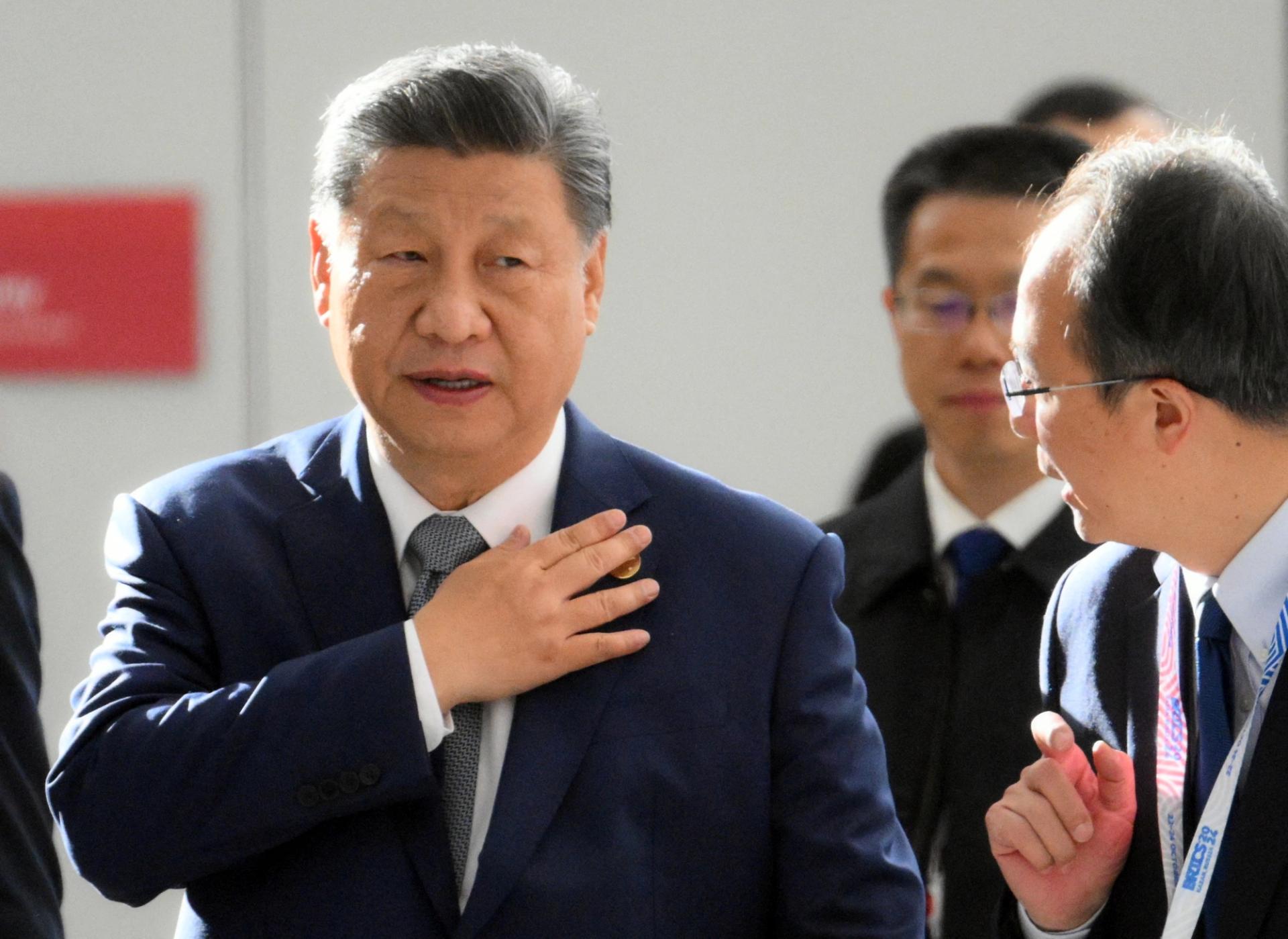 Xi Jinping, wearing a navy suit and grey tie, at the BRICS summit in Kazan, Russia