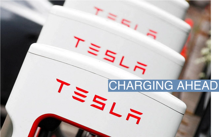 The logo of car manufacturer Tesla is seen at a dealership in London, Britain, May 14, 2021. REUTERS/Matthew Childs/File Photo