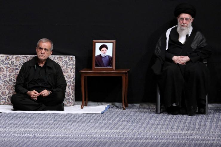 Iran’s President-elect Masoud Pezeshkian and Iran’s Supreme Leader Ayatollah Ali Khamenei attend a Muharram mourning ceremony in Tehran, Iran, on July 12, 2024.