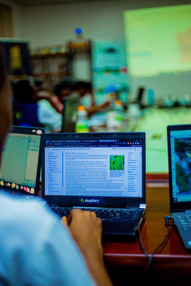 A person uses a computer in Rwanda.