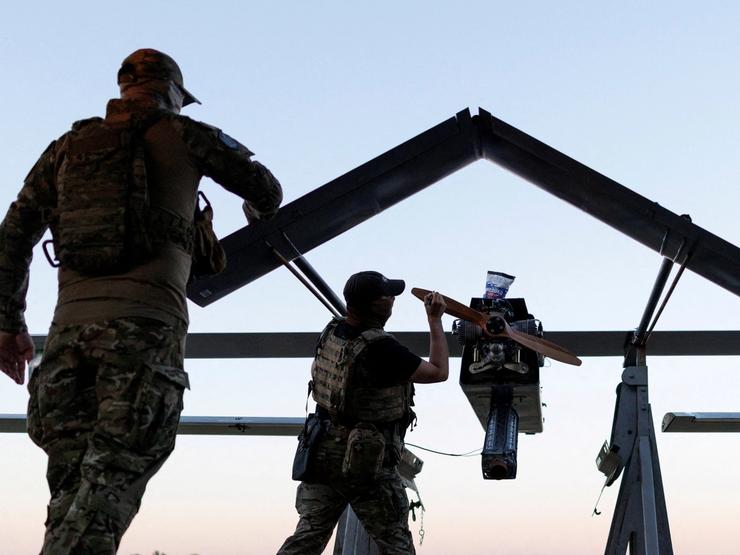Members of the Ukrainian Armed Forces prepare a drone