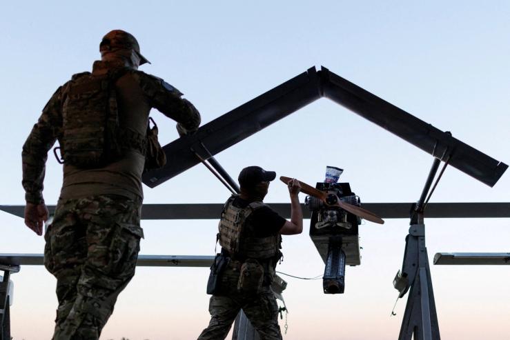 Members of the Ukrainian Armed Forces prepare a drone