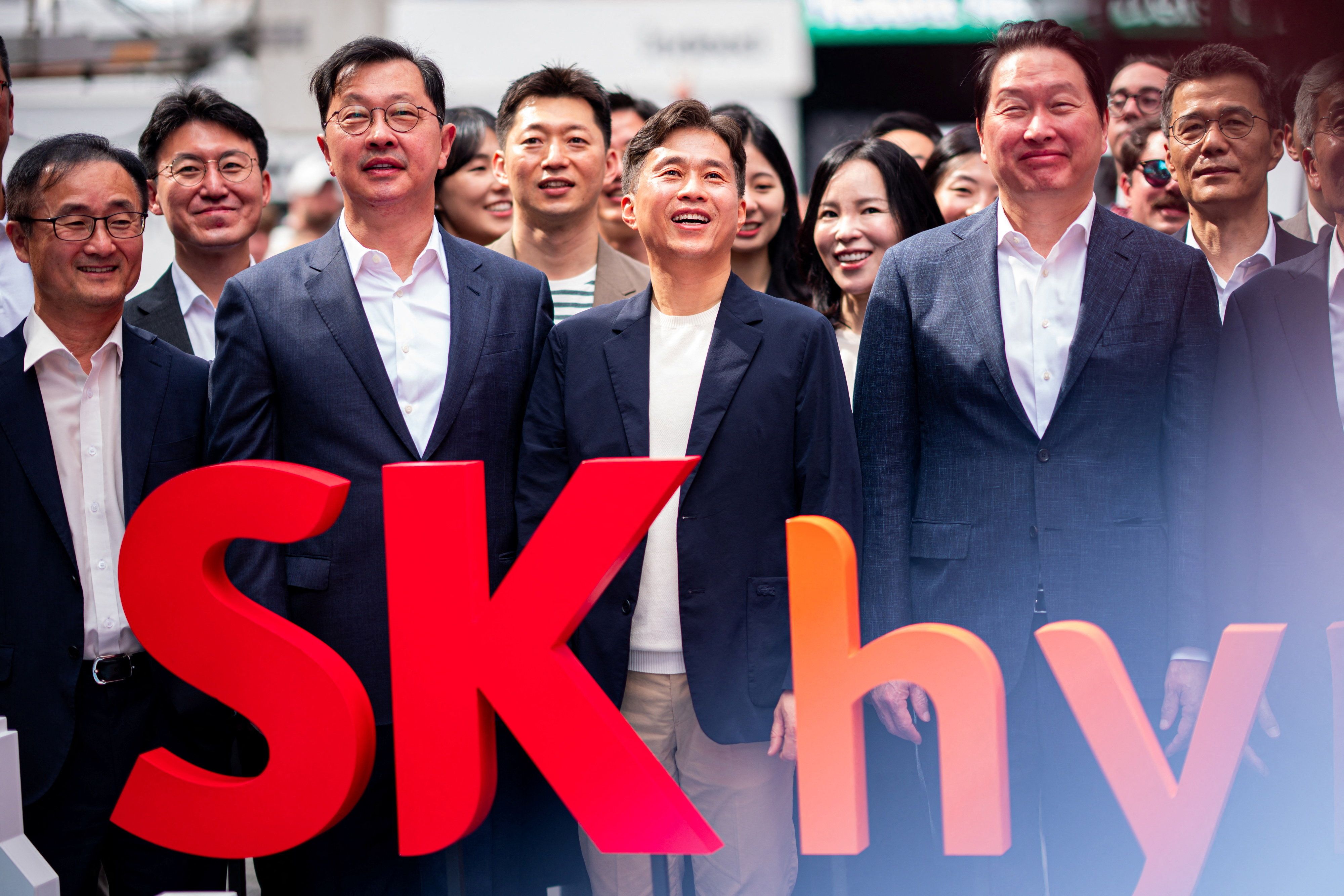 Employees of SK Hynix attend the company’s opening bell ceremony at the Nasdaq market