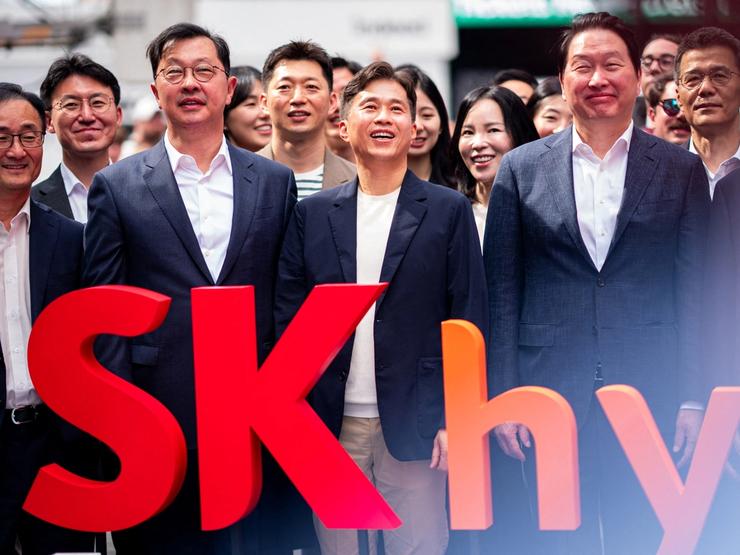 Employees of SK Hynix attend the company’s opening bell ceremony at the Nasdaq market