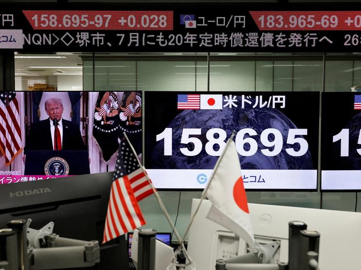 A TV screen broadcasts U.S. President Donald Trump’s speech about the Iran war next at the foreign exchange trading company in Tokyo.