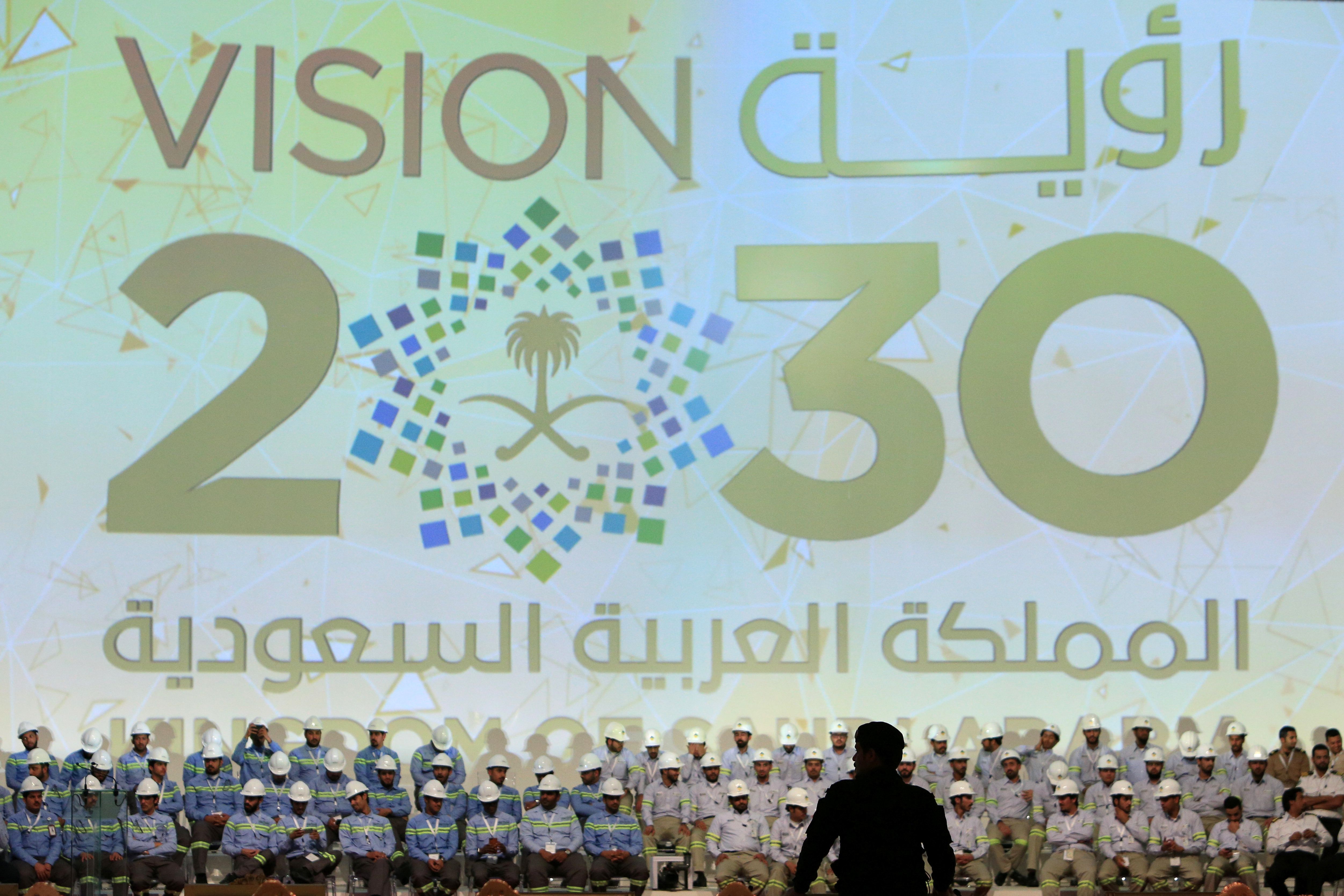 Large banner shows Saudi Vision for 2030.