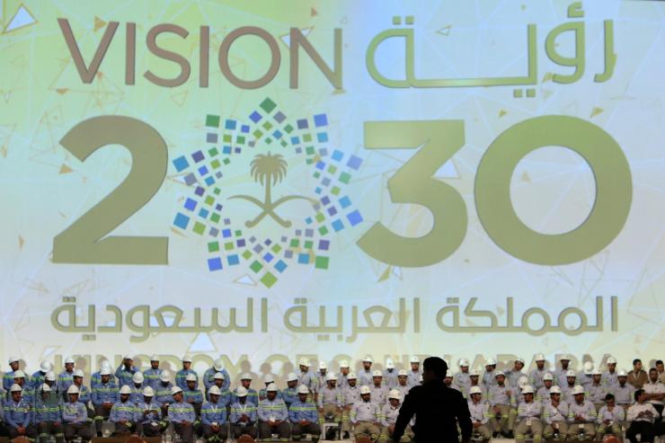 Large banner shows Saudi Vision for 2030.
