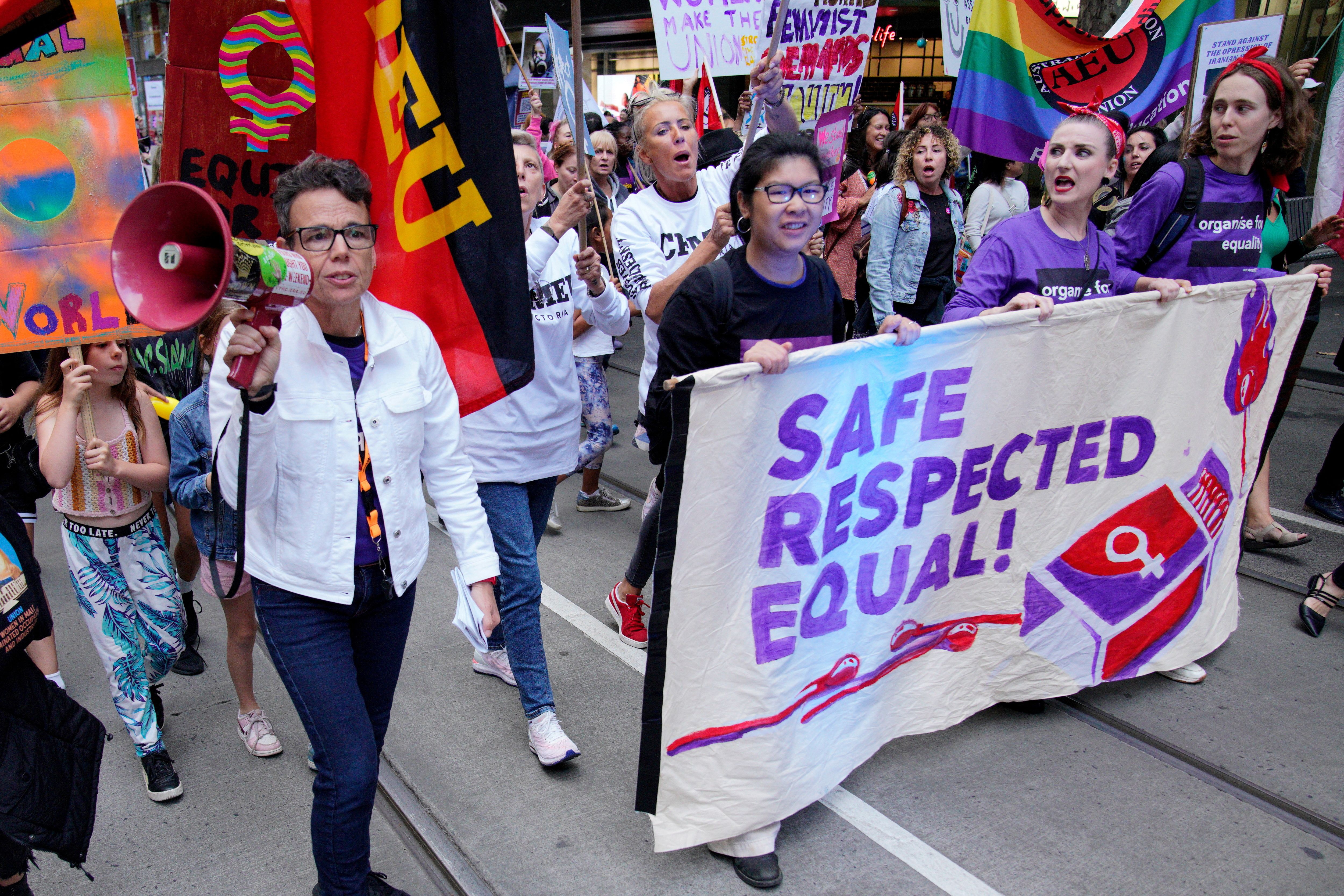 People participate in an International Women’s Day demonstration, in Melbourne, Australia, March 8, 2023. REUTERS/Sandra Sanders