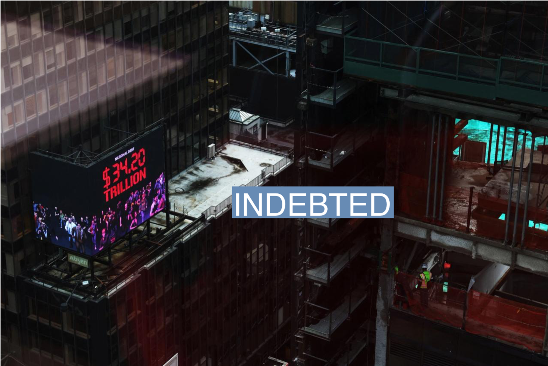A digital advertisement displaying the National Debt counter, including what the federal government owes itself, sits on top of a building in the Times Square area of New York City, U.S., March 7, 2024. 