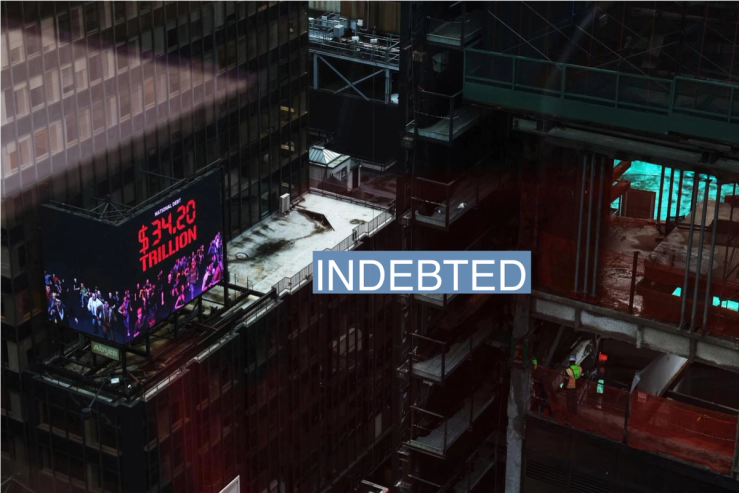 A digital advertisement displaying the National Debt counter, including what the federal government owes itself, sits on top of a building in the Times Square area of New York City, U.S., March 7, 2024.