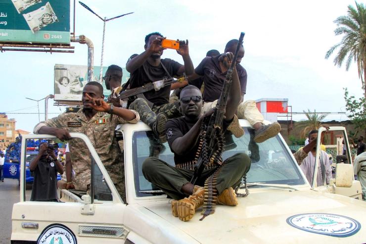 Sudanese army soldiers take part in a military parade.