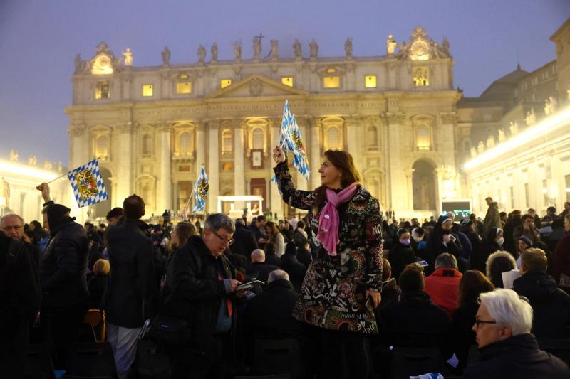 Faithful wait to enter St. Peter’s Square on the day of the funeral of former Pope Benedict at the Vatican.