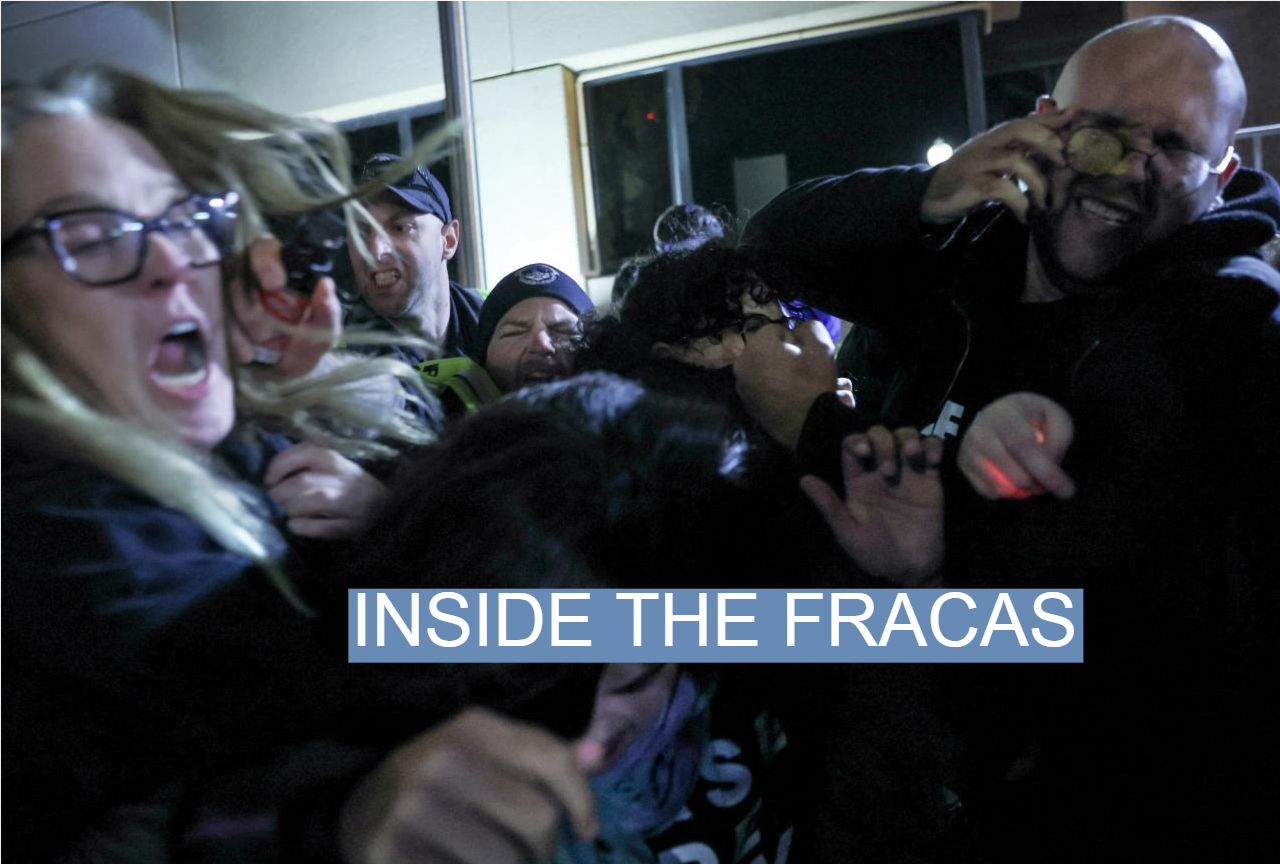 Protesters are pepper sprayed by a police officer outside of the Democratic National Headquarters in Washington, Nov. 15, 2023.