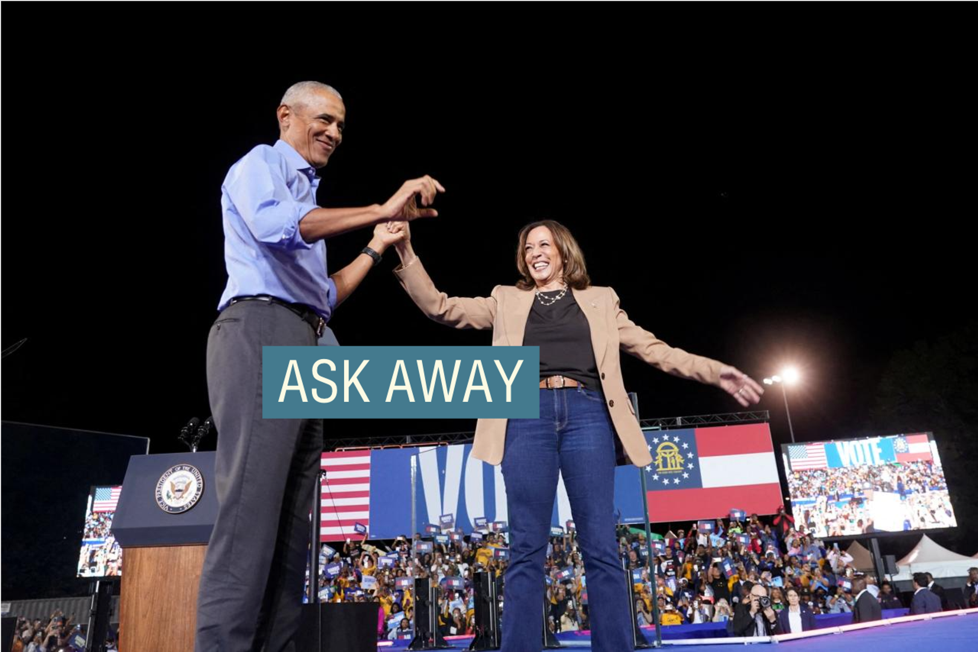 Barack Obama and Kamala Harris smiling on stage together at a Democratic rally in Atlanta, Georgia