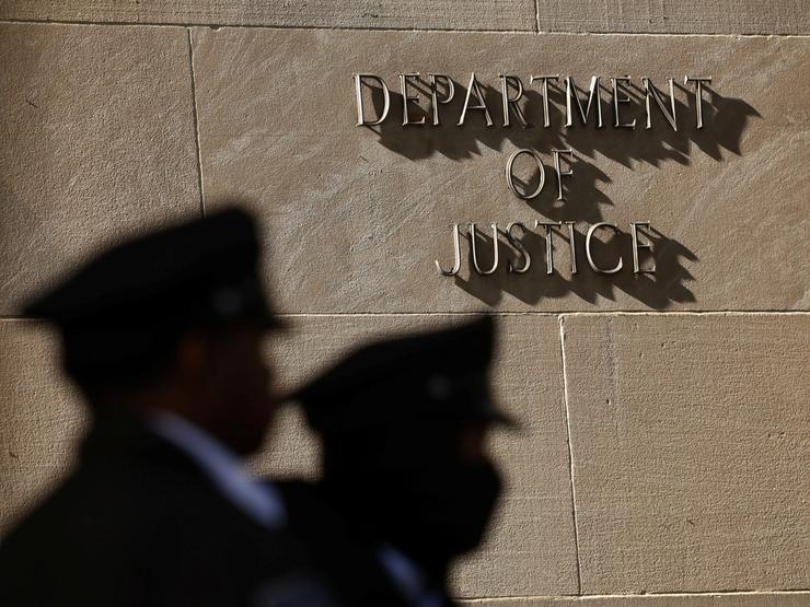 Two guards outside of US Department of Justice