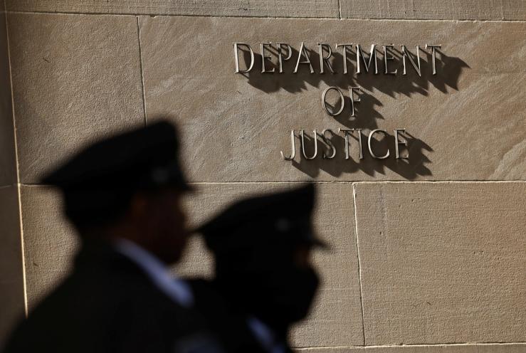 Two guards outside of US Department of Justice