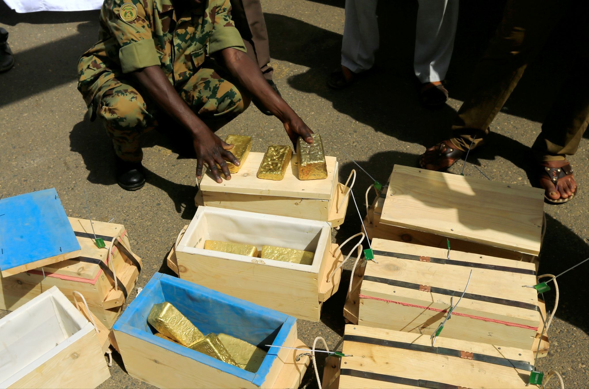 Sudanese Rapid Support Forces display gold bars seized from a plane that landed at Khartoum Airport in 2019. 