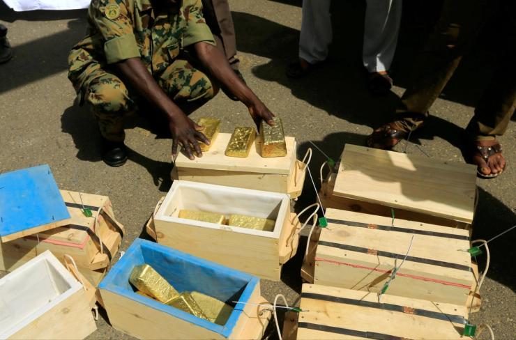 Sudanese Rapid Support Forces display gold bars seized from a plane that landed at Khartoum Airport in 2019.