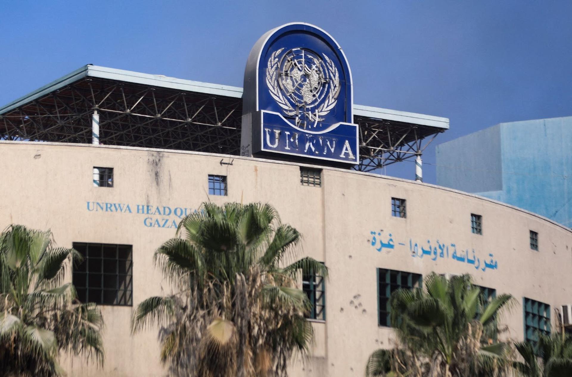 A damaged sign is pictured at the headquarters of UNRWA, following an Israeli raid, amid the Israel-Hamas conflict, in Gaza City.