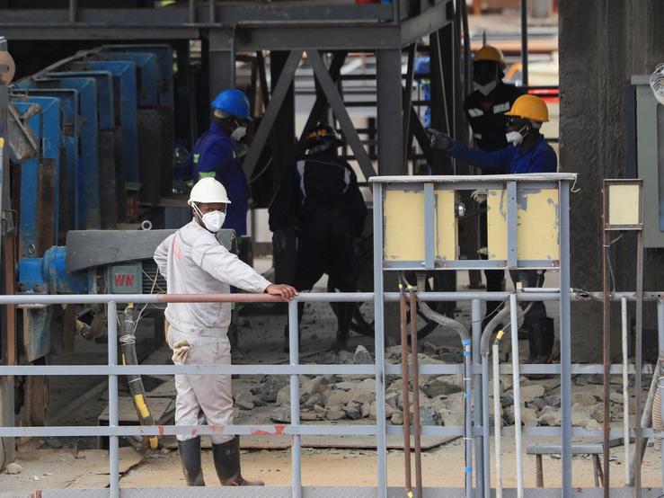 Workers work at Prospect Lithium Zimbabwe mine in Goromonzi, Zimbabwe.