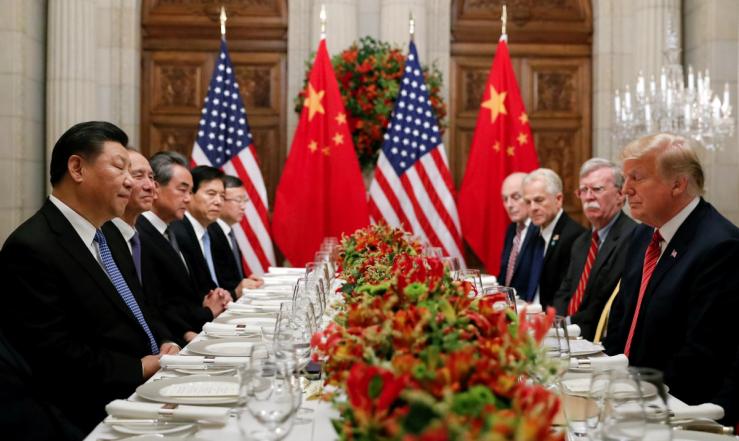 Xi Jinping sits across from Donald Trump