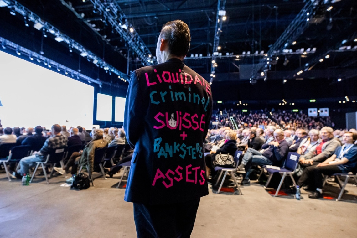 A protestor at Credit Suisse's annual meeting