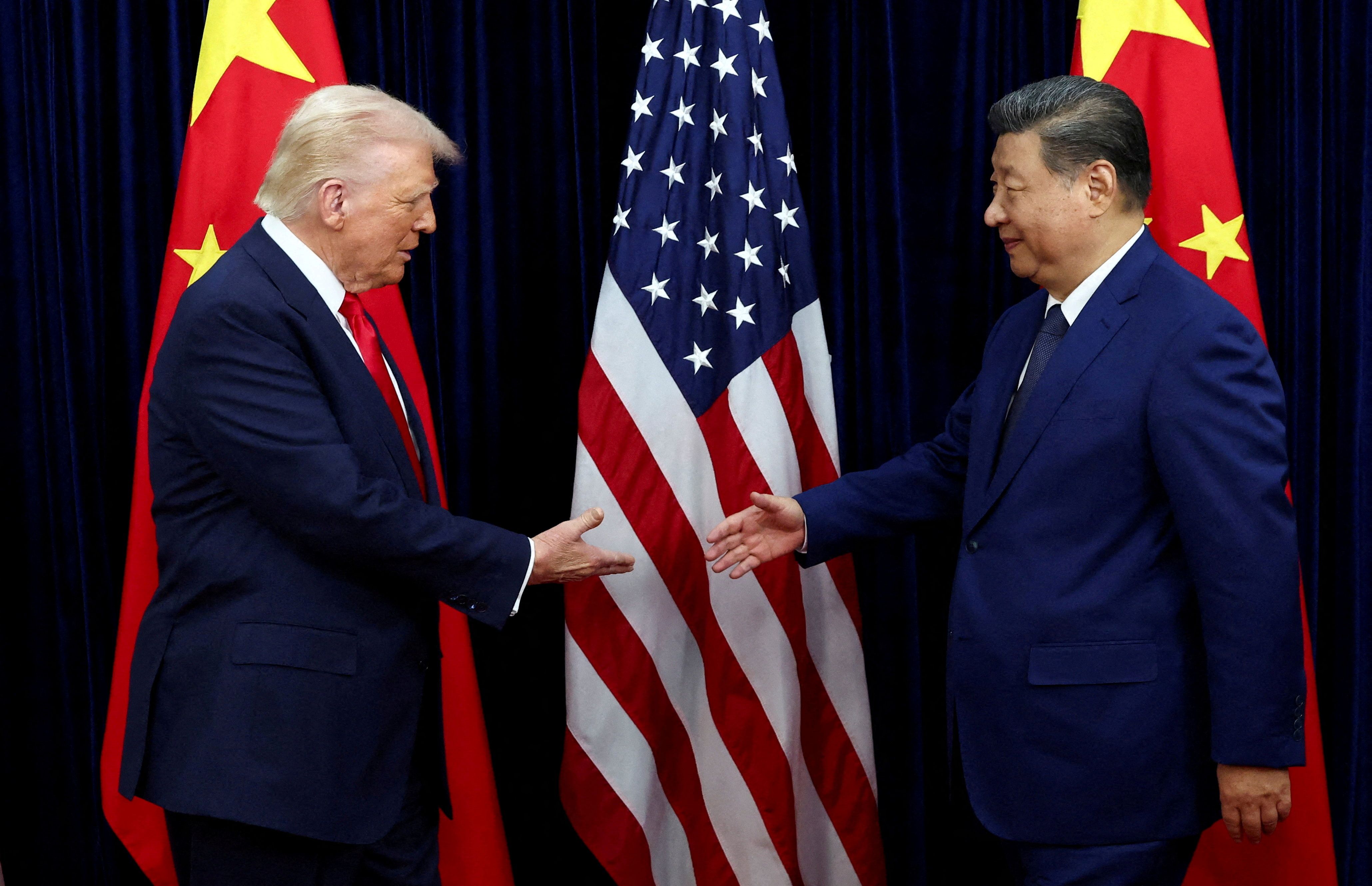 President Donald Trump shakes hands with Chinese President Xi Jinping