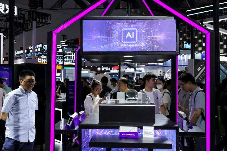 People visit a Metax booth during the World Artificial Intelligence Conference in Shanghai, China.