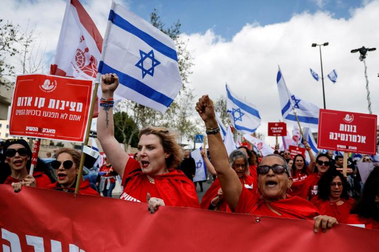 Women dressed as handmaidens from “The Handmaid’s Tale” attend a demonstration after Israeli Prime Minister Benjamin Netanyahu dismissed the defense minister and his nationalist coalition government presses on with its judicial overhaul, in Jerusalem, March 27, 2023. REUTERS/Ammar Awad TPX IMAGES OF THE DAY