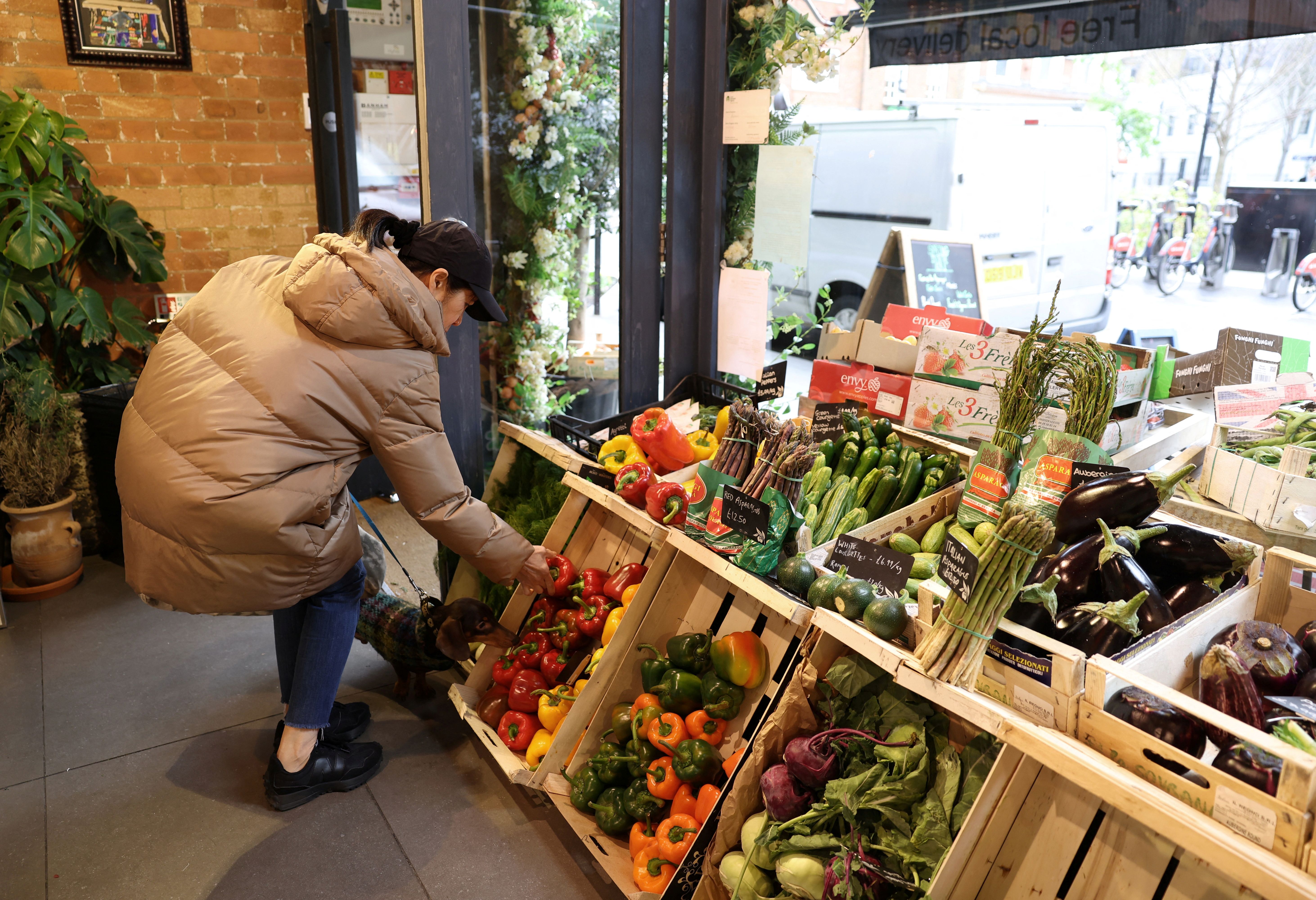 A person buying groceries in London. 