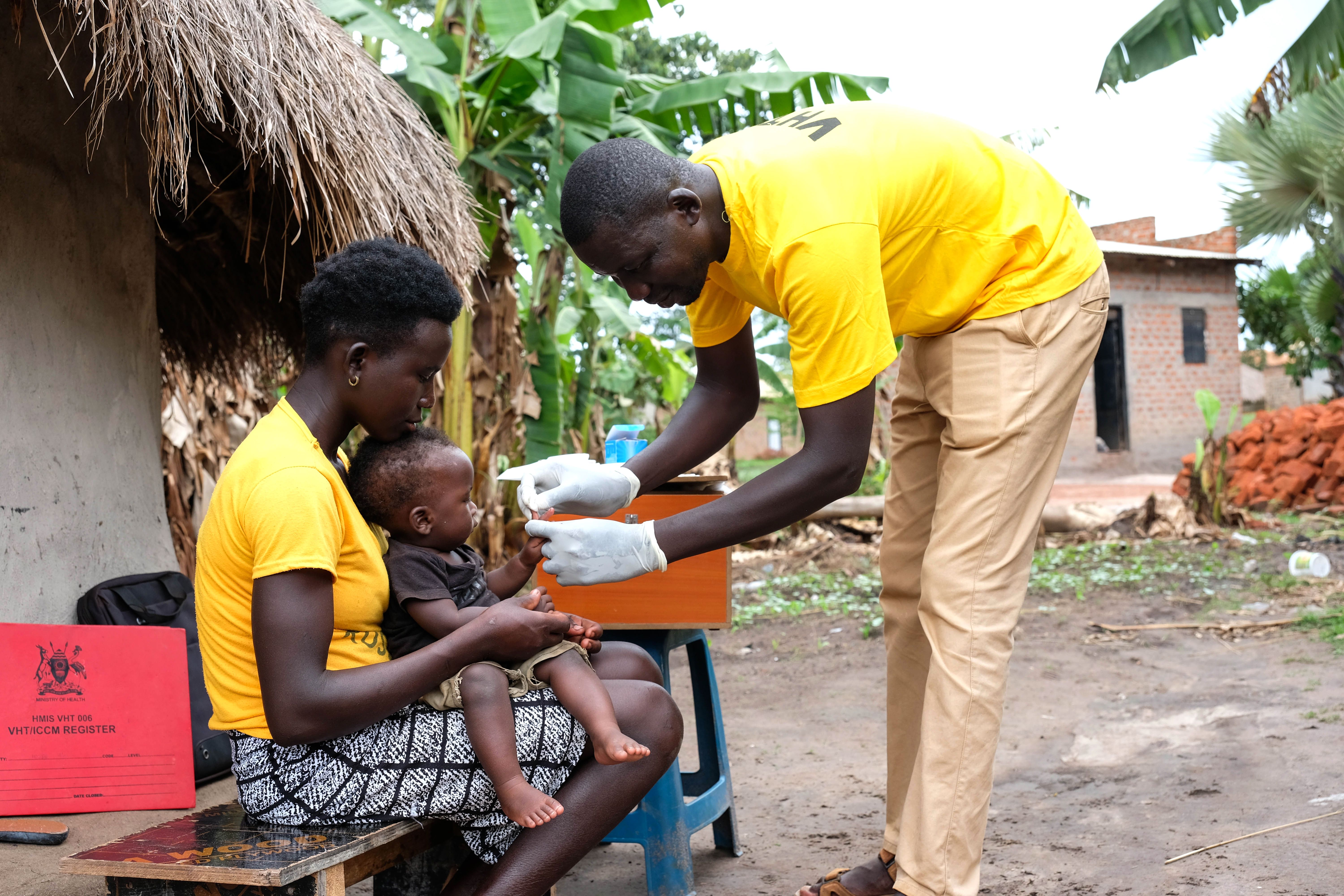 A baby is tested for malaria in Uganda.