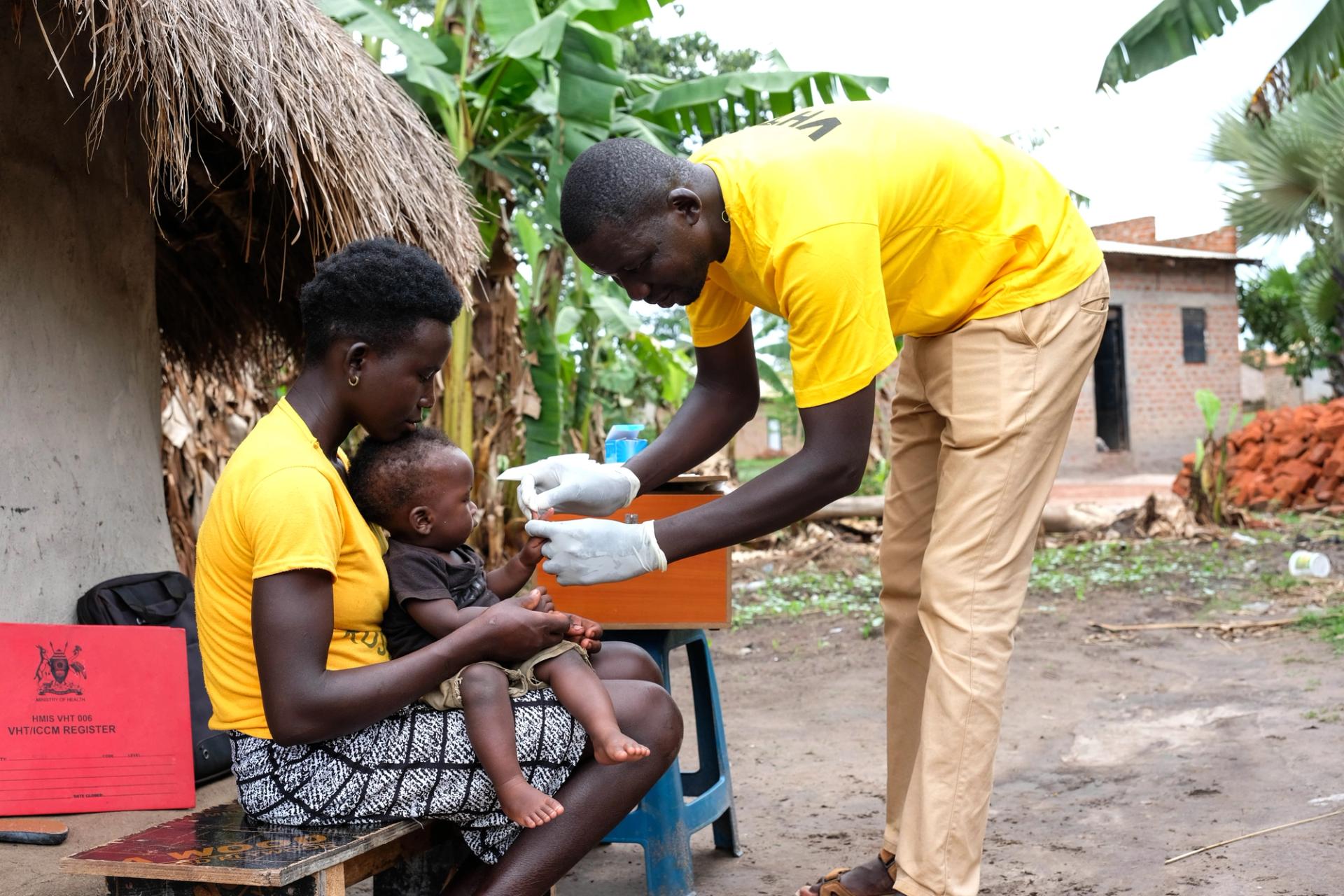A baby is tested for malaria in Uganda.