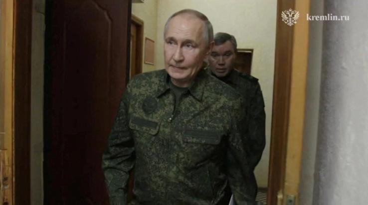 Russia’s President Vladimir Putin visits Russia’s army command centre in the Kursk region on March 12