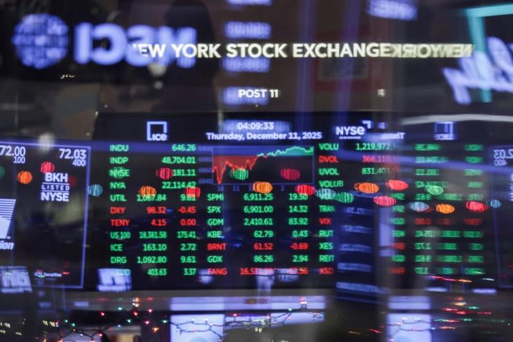 A screen displays the Dow Jones Industrial Average after the close of trading on the floor at the New York Stock Exchange.