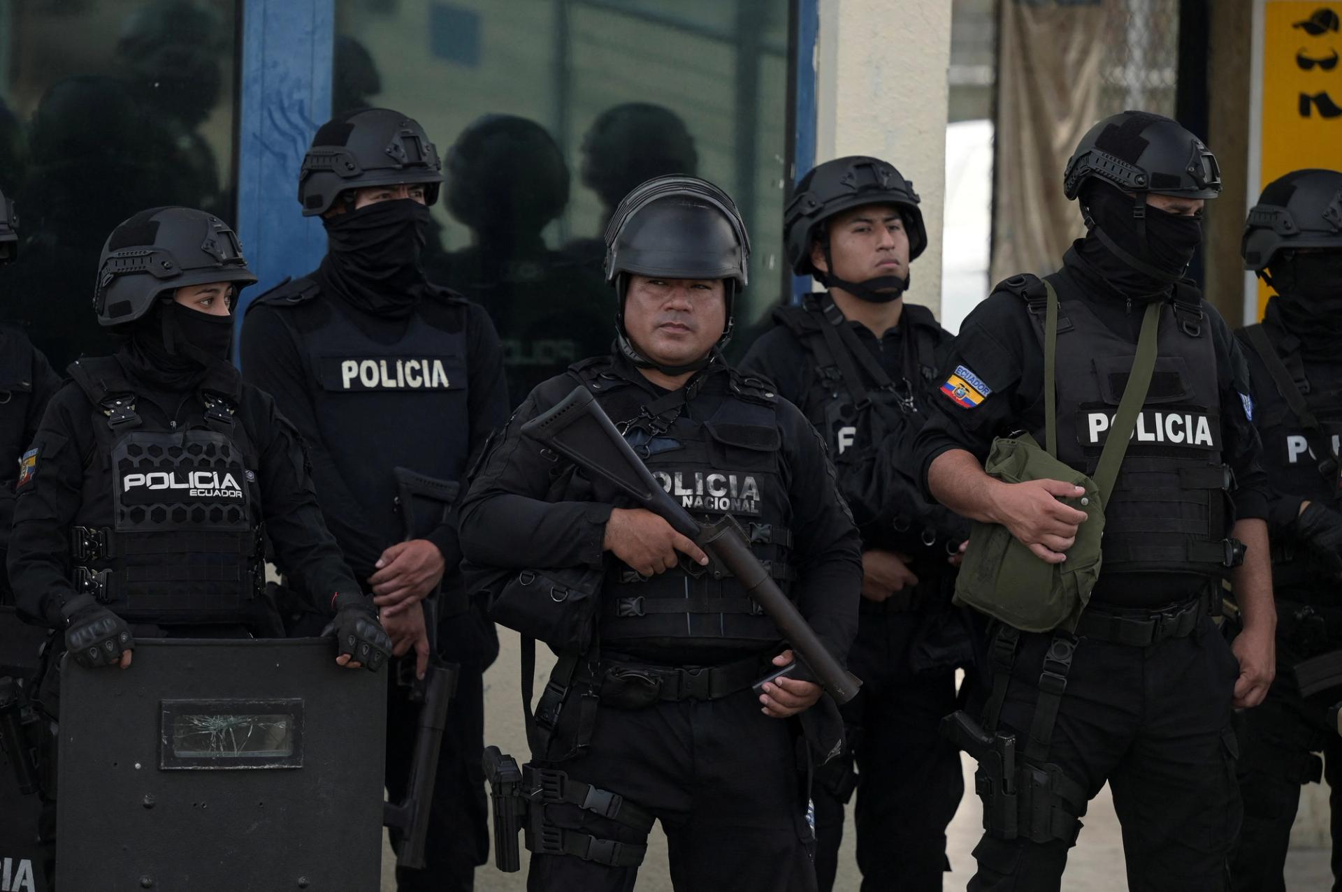 Police officers stand guard as Ecuador's former Vice President Jorge Glas is expected to arrive at the La Roca Prison, after Ecuadorean forces raided Mexico's embassy to arrest Glas.