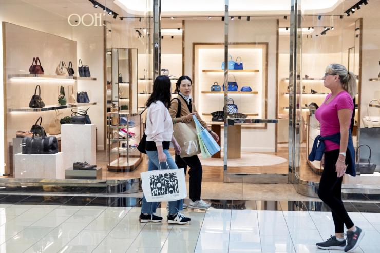 Shoppers walk through King of Prussia mall in PA.