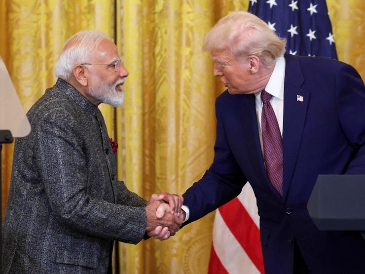 Indian Prime Minister Narendra Modi and US President Donald Trump shake hands.