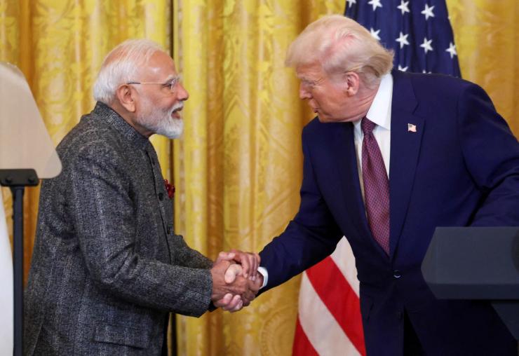 Indian Prime Minister Narendra Modi and US President Donald Trump shake hands.
