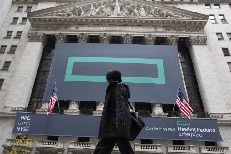 Signs for Hewlett Packard Enterprise Co. cover the facade of the New York Stock Exchange.