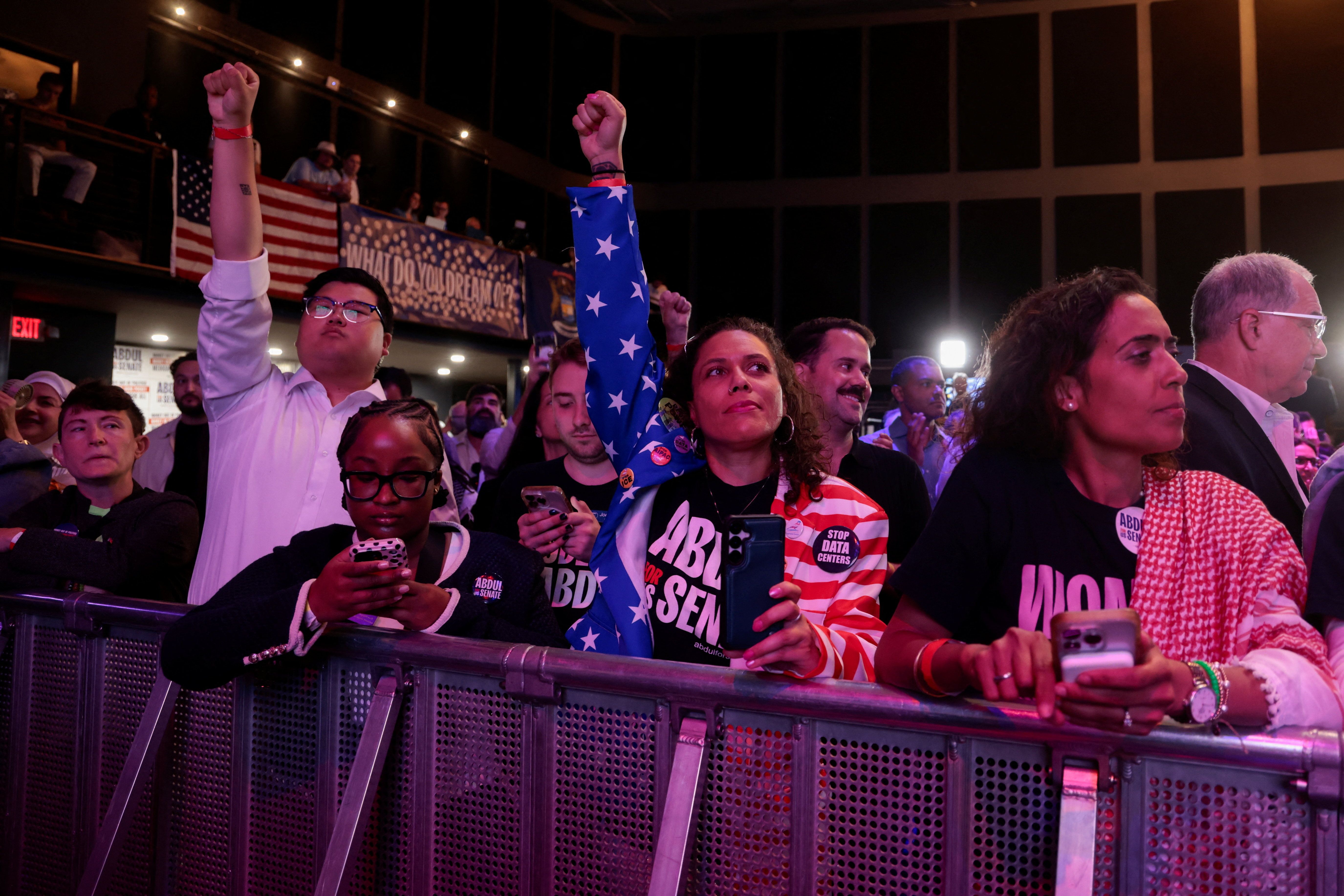 Supporters gesture as early results are displayed during an election night rally for U.S. Senate Democratic candidate Abdul El-Sayed during the primary election, in Detroit, Michigan