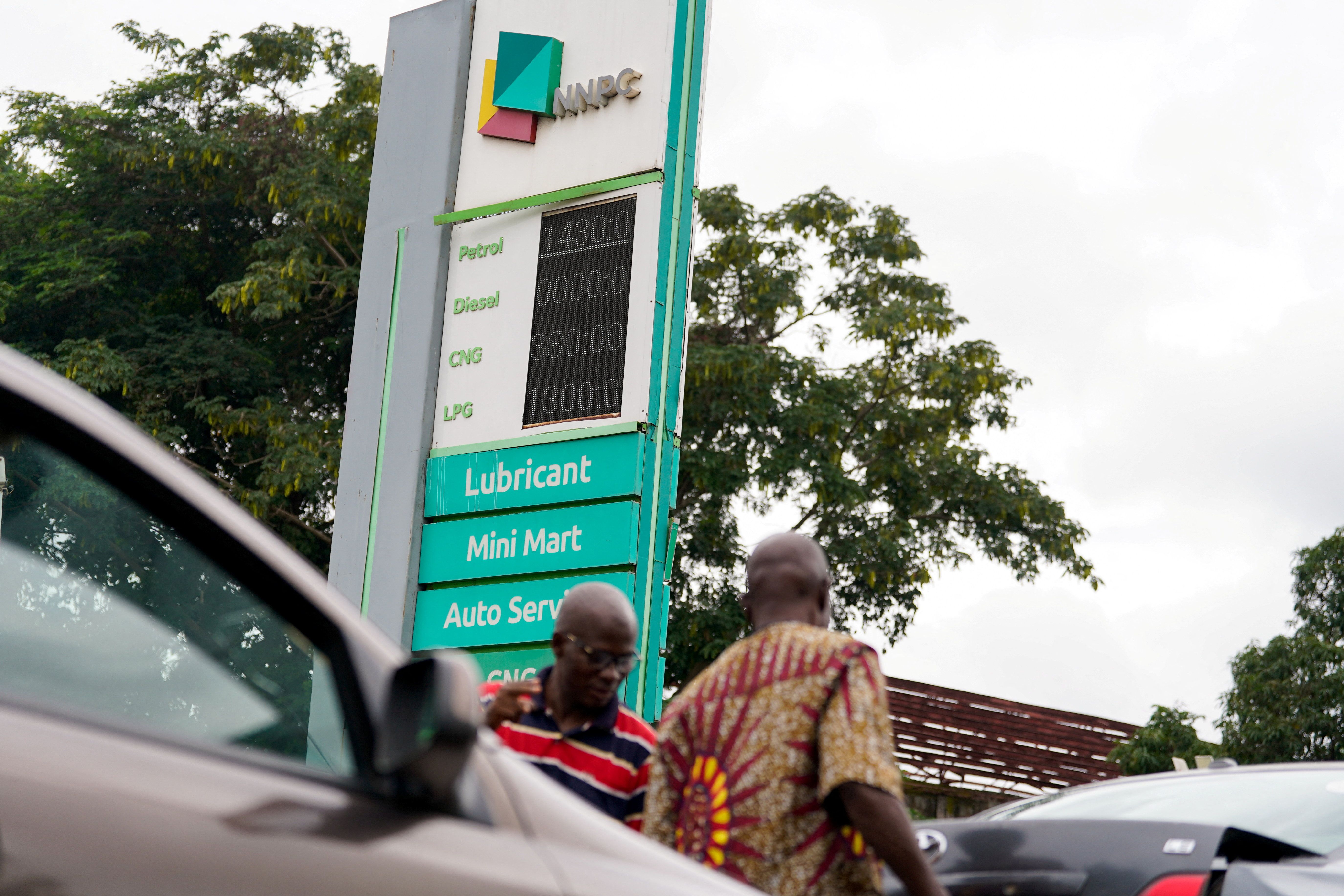 A board displays the price of fuel at a filling station as fuel prices rise in Abuja, Nigeria.