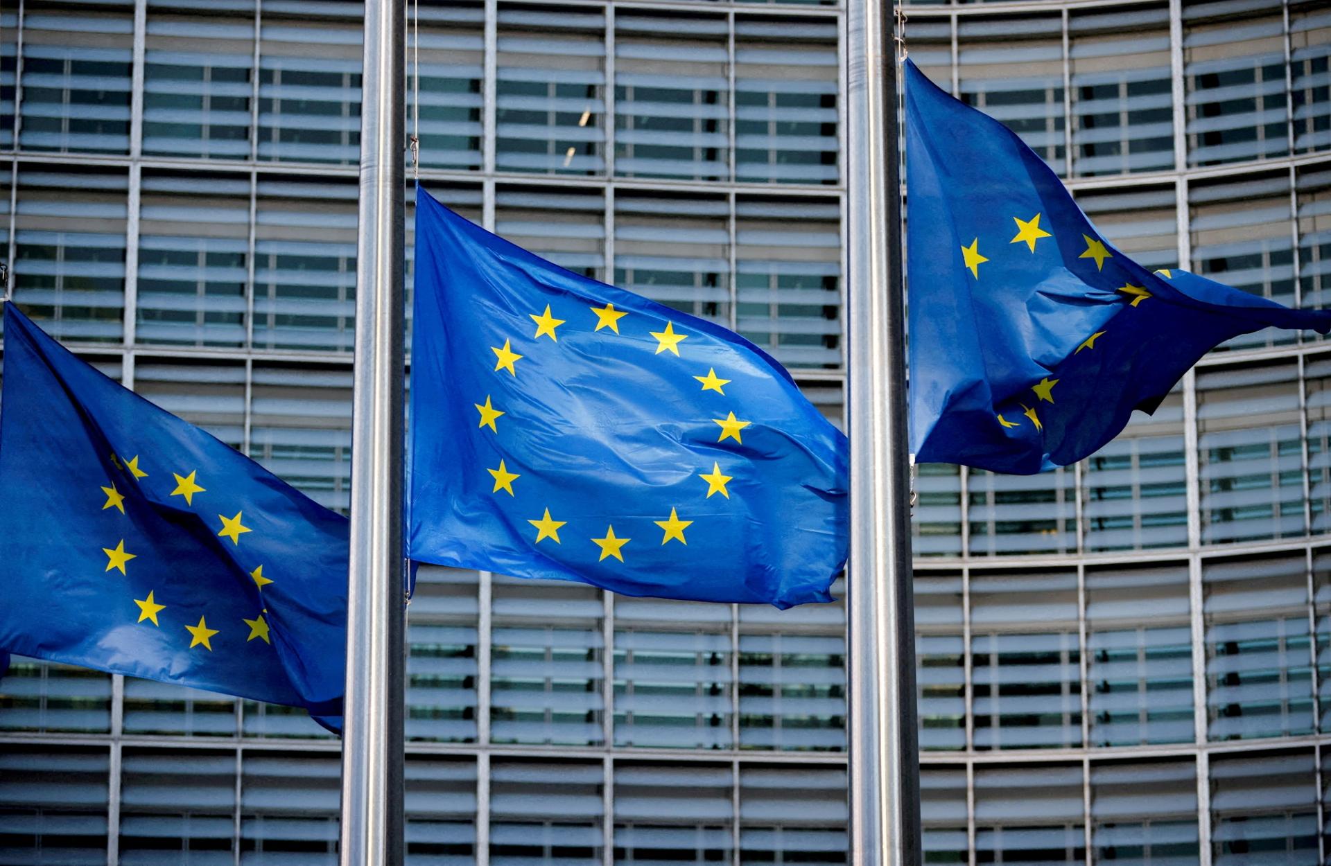 European?Union?flags fly outside the?European?Commission headquarters in Brussels, Belgium, March 1, 2023.