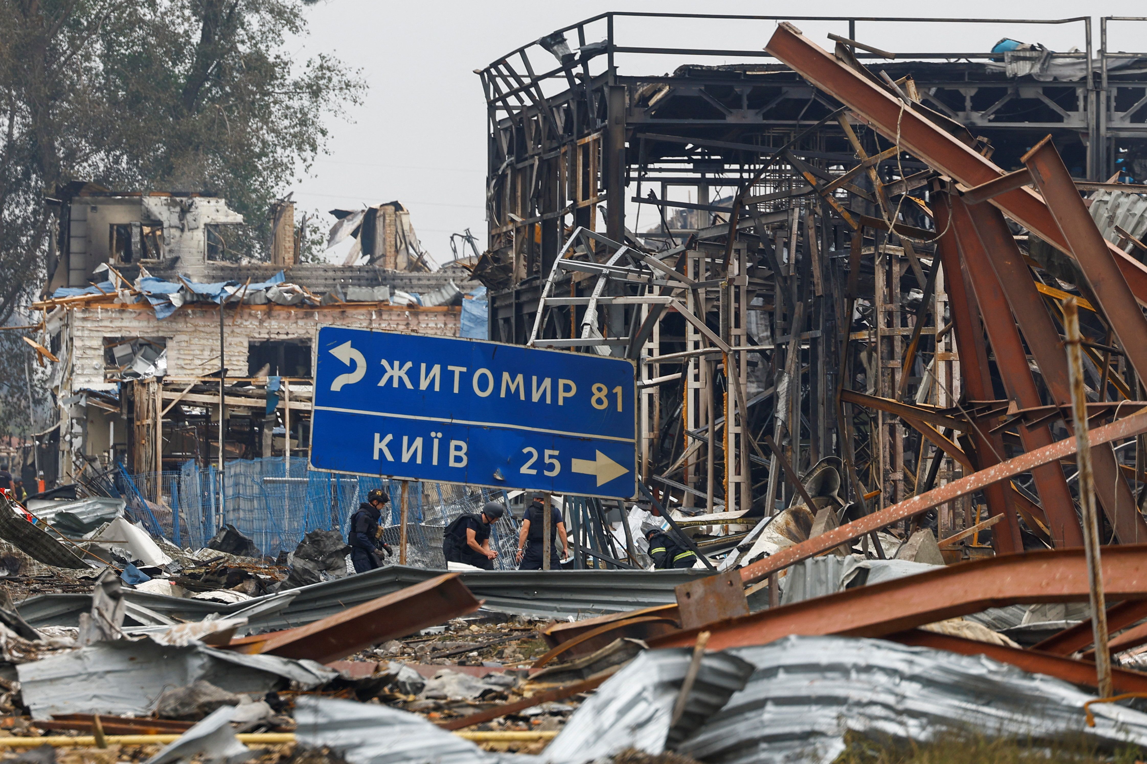 Rescuers work at the site of Friday evening’s Russian drone strikes, amid Russia’s attack on Ukraine