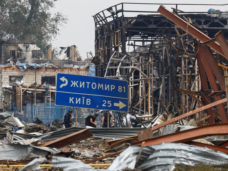 Rescuers work at the site of Friday evening’s Russian drone strikes, amid Russia’s attack on Ukraine